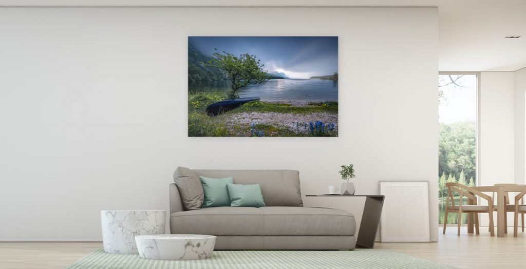 Mockup of a beautiful home with a wall art of a lake and an abandoned boat under a tree.