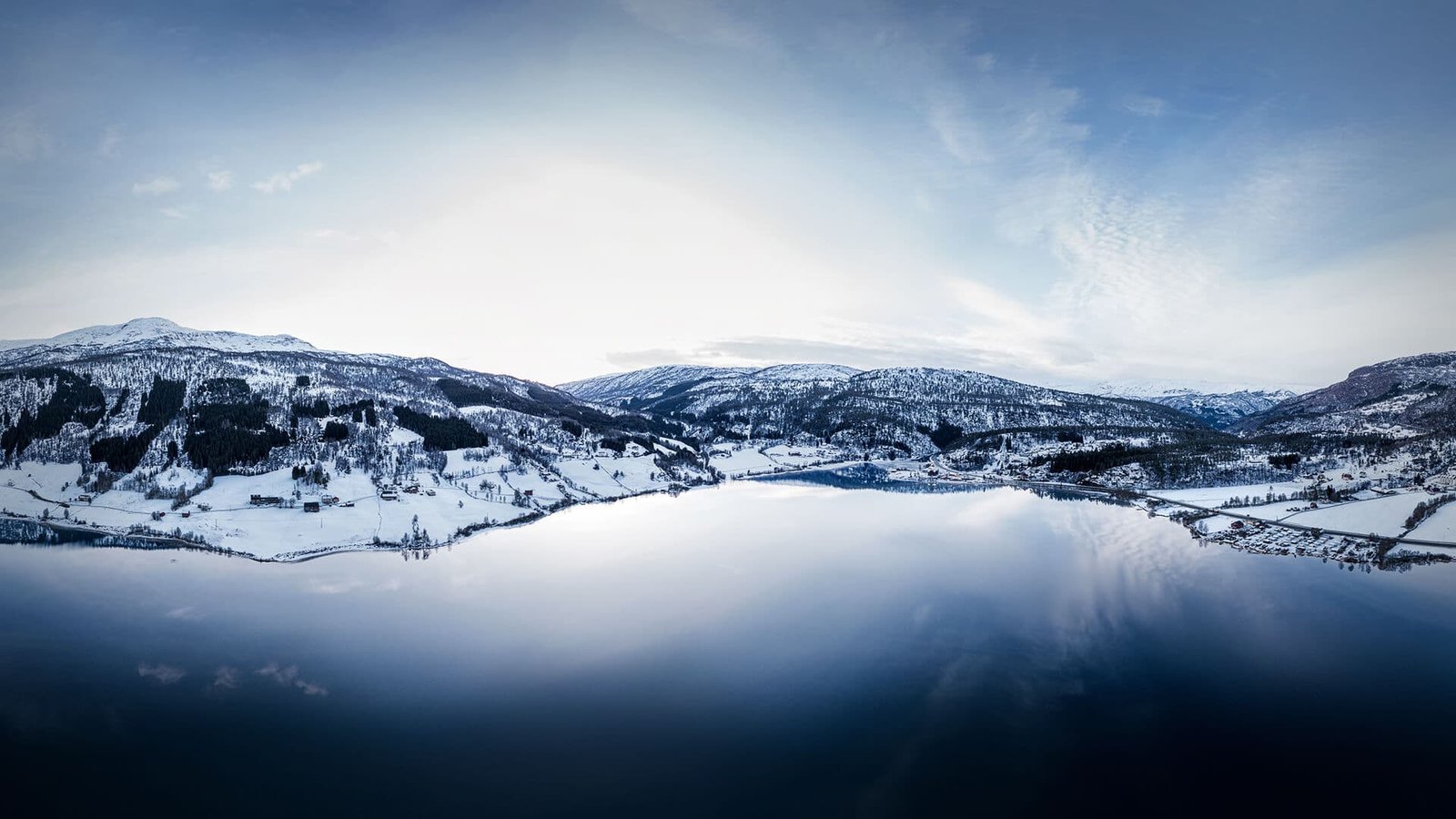 Aerial 360 photograph thumbnail of a crystal clear lake and snowy mountains in Norway
