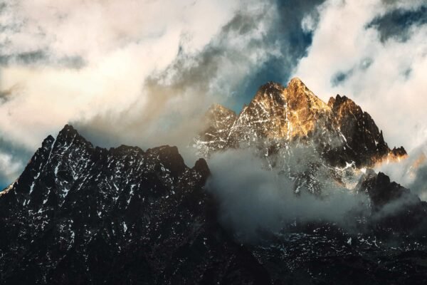 A landscape photograph of a high cloudy mountain