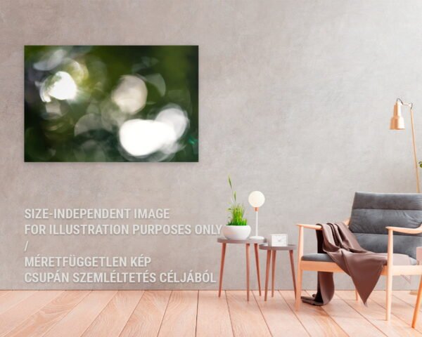 A wall art hanging in a minimalist home. The nature art print is showing nonfigurative lights of a forest.