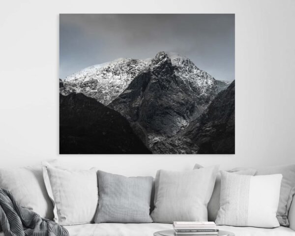 Beautiful mountain photograph hanging on a wall