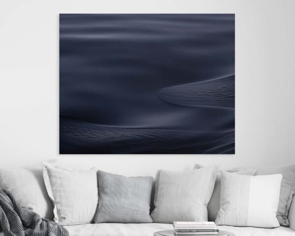Photo of a blue sea texture hanging at a cozy home