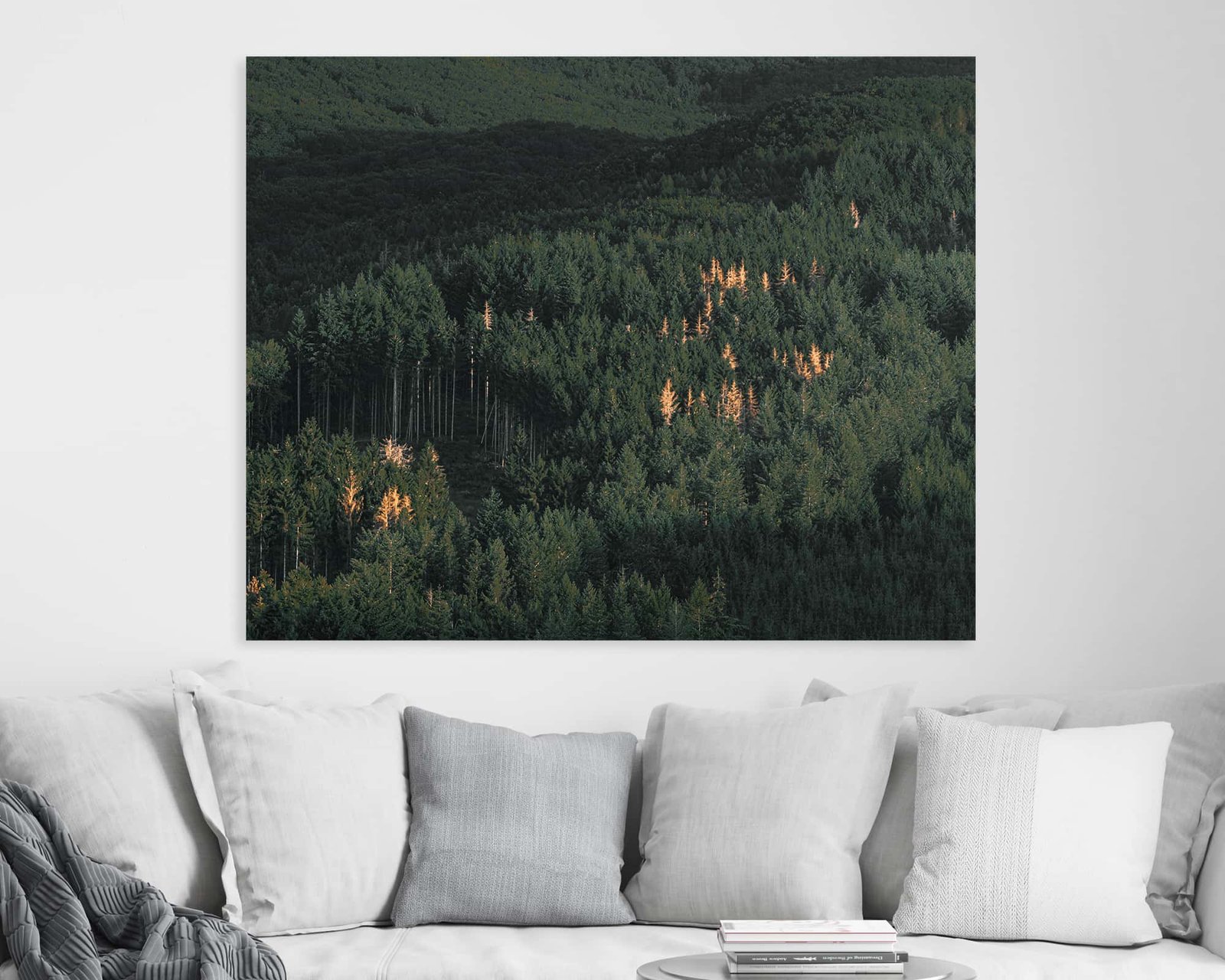Wall art of a dense green forest with some yellow trees in it