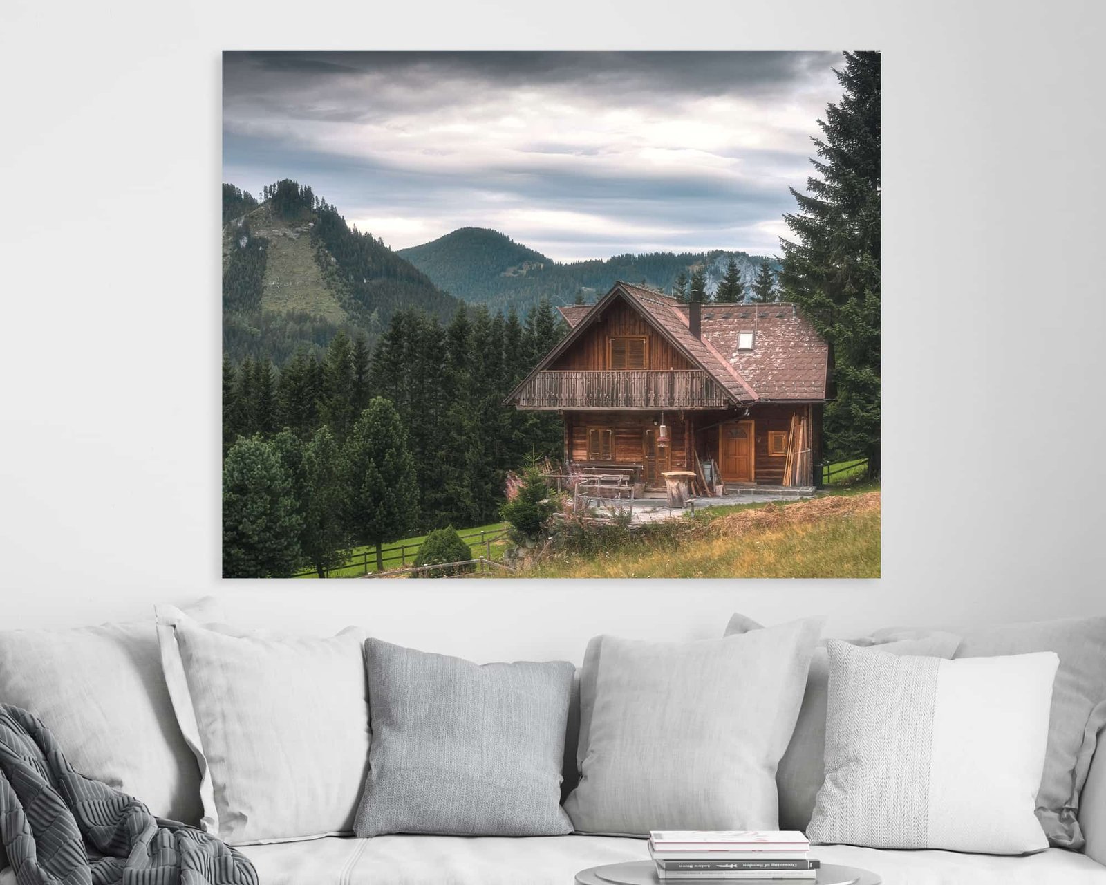 Wall art showing a wooden house facing a mountain