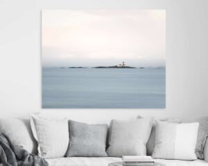 Minimalist wall art of a lighthouse in the middle of a light blue sea